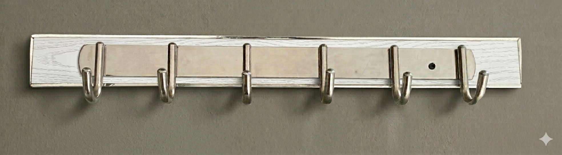 Wall mounted hanger holding kitchen towels and aprons